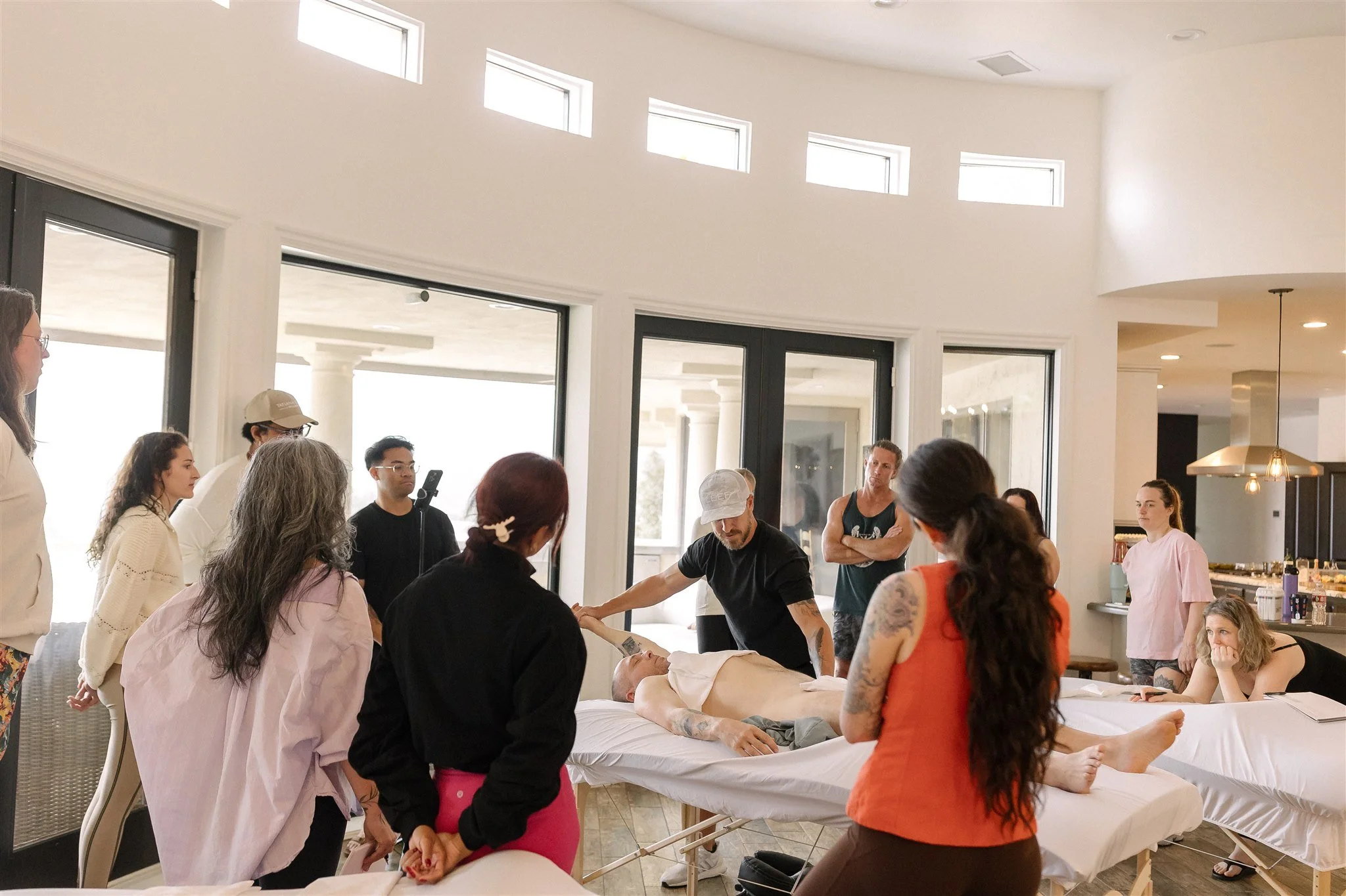 A LEEF House class gathered around a demonstration table